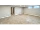 Finished basement featuring neutral carpet, gray walls, and access to the stairwell at 9362 Helmsdale Dr, Indianapolis, IN 46256