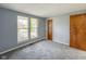 Bedroom with gray walls and carpet and two windows at 9362 Helmsdale Dr, Indianapolis, IN 46256