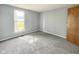 Bedroom featuring neutral carpet and gray walls at 9362 Helmsdale Dr, Indianapolis, IN 46256