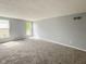 Neutral bedroom with fresh paint, soft carpet, and bright natural light at 9362 Helmsdale Dr, Indianapolis, IN 46256