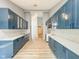 Updated kitchen features long countertops, stainless appliances, and custom cabinetry at 9362 Helmsdale Dr, Indianapolis, IN 46256