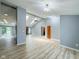 Spacious living room with vaulted ceilings, skylights, and modern flooring at 9362 Helmsdale Dr, Indianapolis, IN 46256
