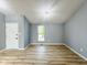 Bright living room with fresh paint, new floors, and a modern lighting fixture at 9362 Helmsdale Dr, Indianapolis, IN 46256