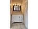Bright bathroom features a modern vanity with granite countertop and ample storage space at 9882 Woodbriar Ln, Carmel, IN 46280