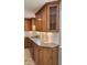 Kitchen featuring granite countertops, ample oak cabinetry, subway tile backsplash, and stainless steel appliances at 9882 Woodbriar Ln, Carmel, IN 46280