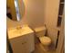 Bathroom featuring a toilet, sink, vanity, and cabinets at 99 Armitage St, Cicero, IN 46034