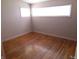Bedroom featuring hardwood floors, natural light from two windows, and neutral walls at 99 Armitage St, Cicero, IN 46034