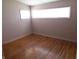 Bedroom featuring hardwood floors, natural light from two windows, and neutral walls at 99 Armitage St, Cicero, IN 46034