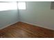 Bedroom featuring hardwood floors, natural light from two windows, and neutral walls at 99 Armitage St, Cicero, IN 46034