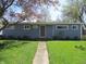 Inviting single-story home with a well-maintained lawn and classic blue siding at 99 Armitage St, Cicero, IN 46034