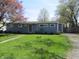 Charming single-story home featuring a well-manicured lawn and a classic blue exterior at 99 Armitage St, Cicero, IN 46034