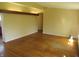 Open-concept living area with hardwood floors and light yellow walls at 99 Armitage St, Cicero, IN 46034