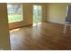 Spacious living room with hardwood floors, a large window and sliding door, and neutral walls at 99 Armitage St, Cicero, IN 46034