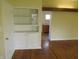 Bright living room with built in cabinet and hardwood floors at 99 Armitage St, Cicero, IN 46034