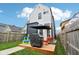Inviting backyard featuring a wood deck, grill, and ample lawn space for outdoor enjoyment at 1015 Villa Ave, Indianapolis, IN 46203