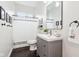 Clean bathroom with a sink, mirror, and shower at 1015 Villa Ave, Indianapolis, IN 46203