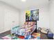 bedroom features colorful comic book bedding, wall art, and cozy decor for a superhero-themed space at 1015 Villa Ave, Indianapolis, IN 46203