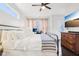 Cozy bedroom featuring dark wood floors, a large TV, and lots of natural light at 1015 Villa Ave, Indianapolis, IN 46203