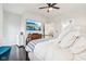 Spacious bedroom featuring a large TV, dark floors, and ensuite bathroom at 1015 Villa Ave, Indianapolis, IN 46203