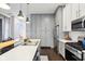 Beautiful kitchen featuring white countertops, stainless steel appliances, and hardwood floors at 1015 Villa Ave, Indianapolis, IN 46203