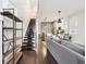 Open-concept living area with hardwood floors, contemporary decor, and staircase to upper level at 1015 Villa Ave, Indianapolis, IN 46203