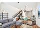 Open-concept living area with modern furnishings, hardwood floors, and plenty of natural light at 1015 Villa Ave, Indianapolis, IN 46203