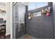 Modern bathroom shower with sleek tile, glass door and built-in niche at 1015 Villa Ave, Indianapolis, IN 46203