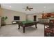 Spacious basement featuring a billiards table, wet bar, and entertainment area at 10814 Tallow Wood Ln, Indianapolis, IN 46236