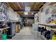 Spacious unfinished basement with exposed ceiling, workshop, and storage spaces at 10814 Tallow Wood Ln, Indianapolis, IN 46236
