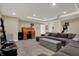Finished basement area with coffered ceiling, media center, and comfortable sectional sofa at 10814 Tallow Wood Ln, Indianapolis, IN 46236