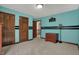 Bedroom featuring a light blue paint scheme with two closets and access to a hallway at 10814 Tallow Wood Ln, Indianapolis, IN 46236