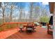 Spacious deck with outdoor seating, grill, and scenic wooded views create a relaxing outdoor living space at 10814 Tallow Wood Ln, Indianapolis, IN 46236