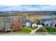 Aerial view of a beautiful home next to a serene pond and golf course, offering a picturesque setting at 10846 Hamilton Pass, Fishers, IN 46037