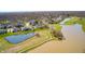 Picturesque aerial shot of a residential neighborhood with ponds and green spaces at 10846 Hamilton Pass, Fishers, IN 46037