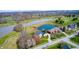 Overhead shot of a golf course and a large pond adjacent to luxurious homes in a serene neighborhood at 10846 Hamilton Pass, Fishers, IN 46037