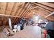 Large unfinished attic featuring exposed beams and plywood flooring at 10846 Hamilton Pass, Fishers, IN 46037