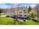 A large backyard features a patio, mature trees, and ample space for relaxation and entertaining at 10846 Hamilton Pass, Fishers, IN 46037
