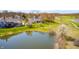A beautifully landscaped backyard overlooks a peaceful pond and golf course at 10846 Hamilton Pass, Fishers, IN 46037