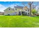 Spacious backyard with lush green lawn and patio offers ample space for outdoor enjoyment and entertaining at 10846 Hamilton Pass, Fishers, IN 46037