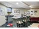 Finished basement bar area with bar-height seating and sink at 10846 Hamilton Pass, Fishers, IN 46037