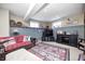 Finished basement with a red plaid sofa, tv, and decorative shelving at 10846 Hamilton Pass, Fishers, IN 46037