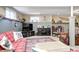Finished basement featuring leather chairs, a red sofa, and mounted decor at 10846 Hamilton Pass, Fishers, IN 46037
