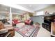 Basement featuring two red plaid sofas, tv and a dining area at 10846 Hamilton Pass, Fishers, IN 46037