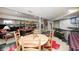 Finished basement area boasts a dining table, bar, and entertainment area at 10846 Hamilton Pass, Fishers, IN 46037
