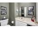 Charming bathroom featuring a toilet, vanity with sink, and beautifully decorated walls at 10846 Hamilton Pass, Fishers, IN 46037