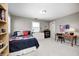Neutral bedroom with a bed, large dresser, and wooden desk at 10846 Hamilton Pass, Fishers, IN 46037