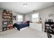 Neutral bedroom featuring two windows, a bed, and dresser at 10846 Hamilton Pass, Fishers, IN 46037