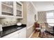 Inviting dining room with built-in cabinetry and elegant wallpaper at 10846 Hamilton Pass, Fishers, IN 46037