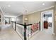 Spacious hallway with neutral carpet, white trim, and a decorative chandelier at 10846 Hamilton Pass, Fishers, IN 46037