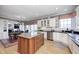 Bright kitchen with granite countertops, stainless steel appliances, and hardwood floors at 10846 Hamilton Pass, Fishers, IN 46037